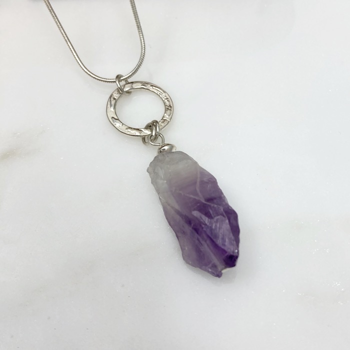 Amethyst rough cut nugget pendant with patterned sterling ring on a sterling snake chain.